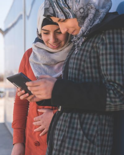 On 19 January 2017 in Jordan, two adolescent girls use a cellphone outside a solar kiosk in the Za’atari camp for Syrian refugees, in Mafraq Governorate, near the Syrian border. The kiosk – supported by worldwide solar energy provider SOLARKIOSK AG; systems and services provider SES Techcom Services (an affiliate of global satellite operator SES); and UNICEF – provides internet connectivity and is equipped with tablets and computers. It also serves as a charging station for cellphones and other electronics equipment, and as an e-learning centre for children and youths in the camp. More than 80,000 people currently shelter in the Za’atari camp. Over half of them are children.

Primero is an open source technology platform enabling governments, aid agencies and social service workers to provide life-saving services and conduct case management for most vulnerable children was launched by key players in the humanitarian sector including UNFPA, UNHCR, the International Medical Corps, International Rescue Committee, and UNICEF in February 2017. Primero was created as a case management tool that enables social workers in the field to manage children displaced by conflict and provide them with a means to access basic services including family reunification in their host communities. In response to humanitarian crisis Primero is preparing for scale in humanitarian settings in host communities Lebanon, Jordan and the Kakuma refugee camp in Kenya. Primero is also being adapted and deployed for the case management of most vulnerable children in non-humanitarian contexts, more broadly. It is a highly configurable web application and mobile app that can run on a laptop, a privately-hosted server, or in a managed cloud environment enabling case workers on the move in refugee camps and in remote locations. As an open source tool Primero’s code is publically available and encourages further application for children in communities displaced by conflict and crisis, and in